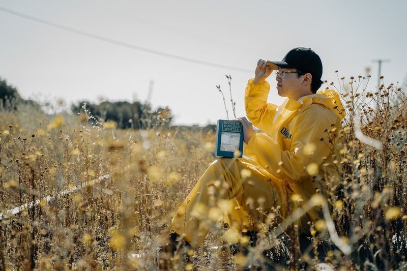 A figure in yellow in a golden field