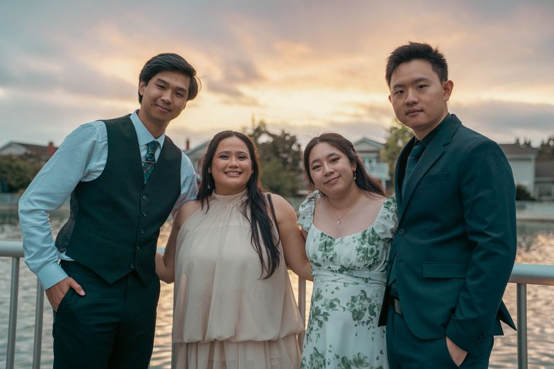 A family portrait at sunset by the water