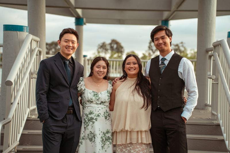 A group portrait in a white gazebo